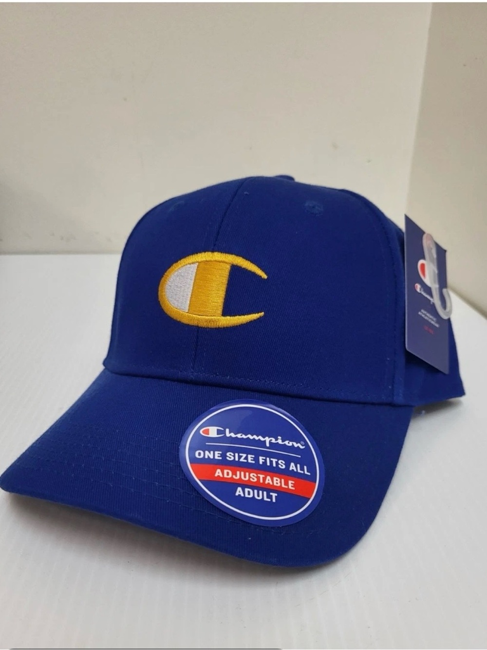 #3077**Champion Royal Blue Curved-Brim Baseball Hat with Yellow Logo